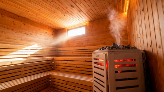 A cedar sauna interior at golden-hour morning light angled through a small high window, warm amber tones on Grade-A Canadian…